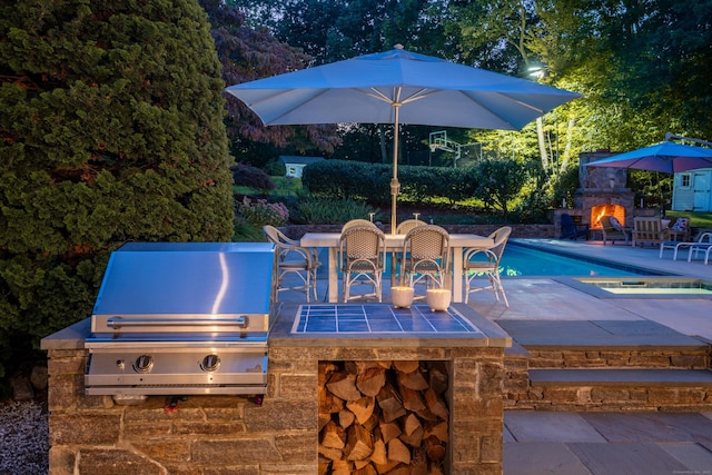 63 Balfour Dr, West Hartford, CT 06117 - view of patio / terrace featuring a warm lit fireplace, grilling area, and an outdoor pool