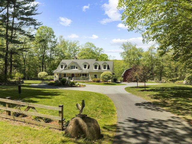 140 Podunk Rd, Guilford, CT 06437 - cape cod home with curved driveway, a chimney, and covered porch