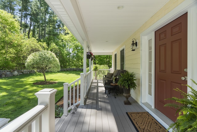 140 Podunk Rd, Guilford, CT 06437 - wooden porch featuring a yard