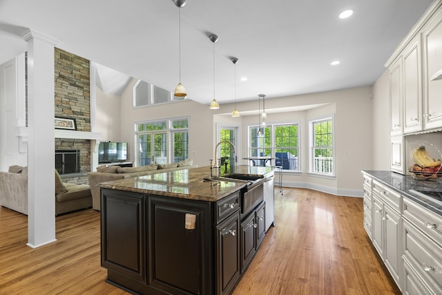 140 Podunk Rd, Guilford, CT 06437 - kitchen featuring a sink, light wood-style floors, white cabinetry, healthy amount of natural light, and recessed lighting