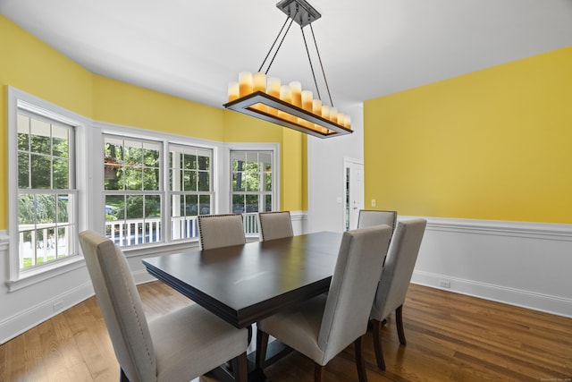 140 Podunk Rd, Guilford, CT 06437 - dining room featuring wood finished floors, baseboards, and a chandelier