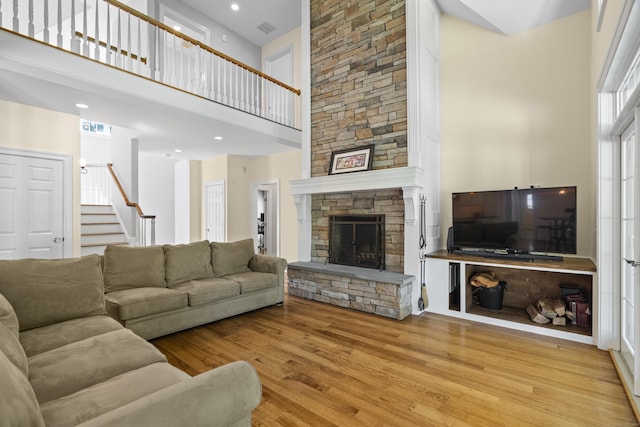 140 Podunk Rd, Guilford, CT 06437 - living area featuring a high ceiling, wood finished floors, a fireplace, stairs, and recessed lighting