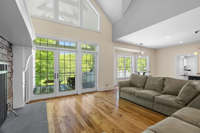 140 Podunk Rd, Guilford, CT 06437 - living area with wood finished floors and a stone fireplace
