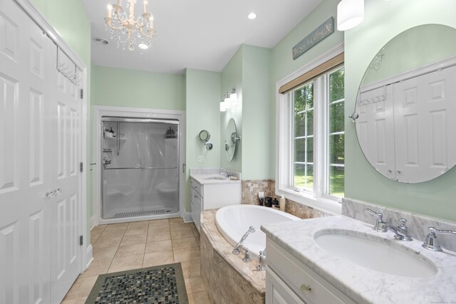 140 Podunk Rd, Guilford, CT 06437 - full bath with a stall shower, a bath, a chandelier, tile patterned floors, and two vanities