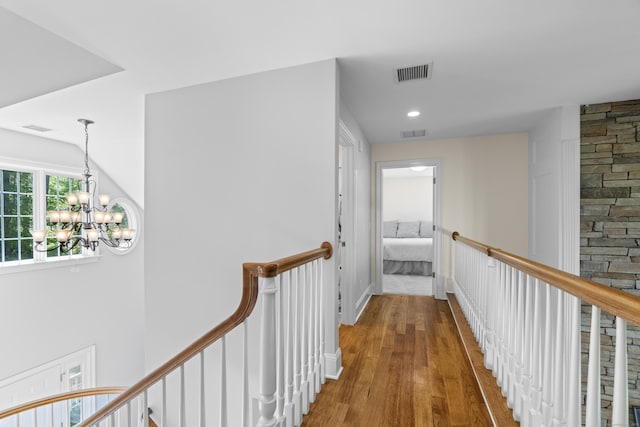 140 Podunk Rd, Guilford, CT 06437 - hallway with an upstairs landing, wood finished floors, a chandelier, and recessed lighting