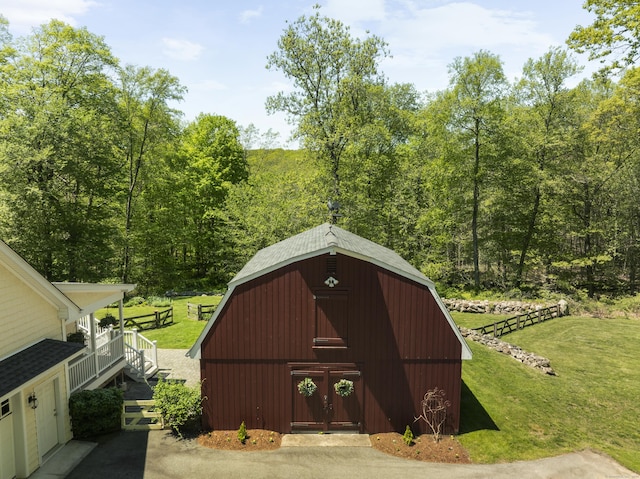 140 Podunk Rd, Guilford, CT 06437 - view of barn featuring a lawn and a forest view