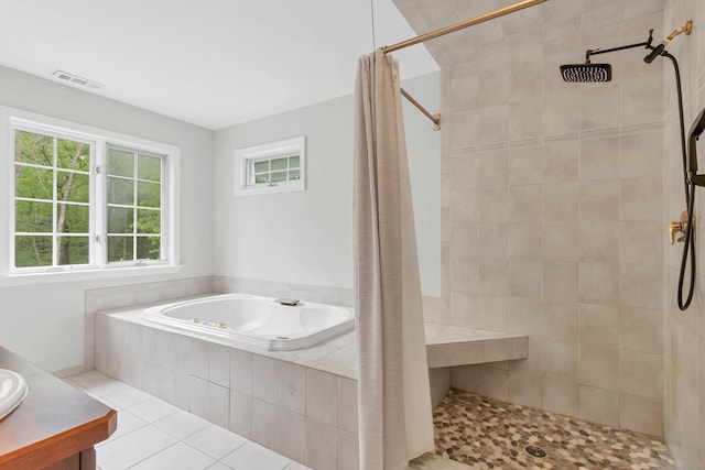 full bath with a tile shower, a garden tub, and tile patterned floors