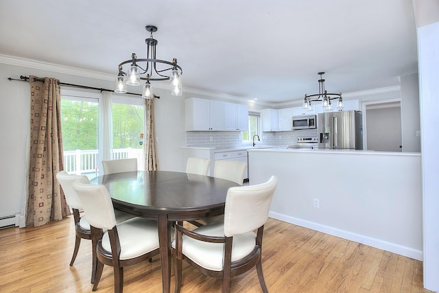 23 Davis Rd, Seymour, CT 06483 - dining area featuring a chandelier, light wood-type flooring, and ornamental molding