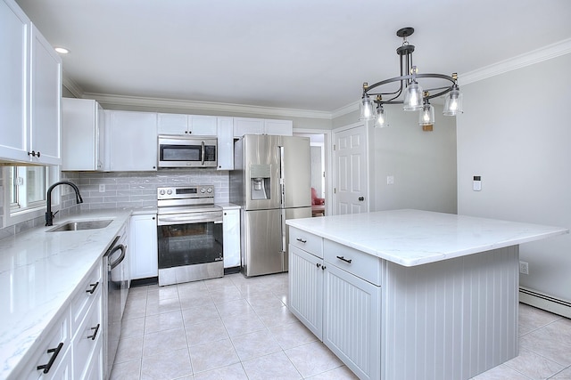 23 Davis Rd, Seymour, CT 06483 - kitchen featuring stainless steel appliances, tasteful backsplash, crown molding, a center island, and baseboard heating