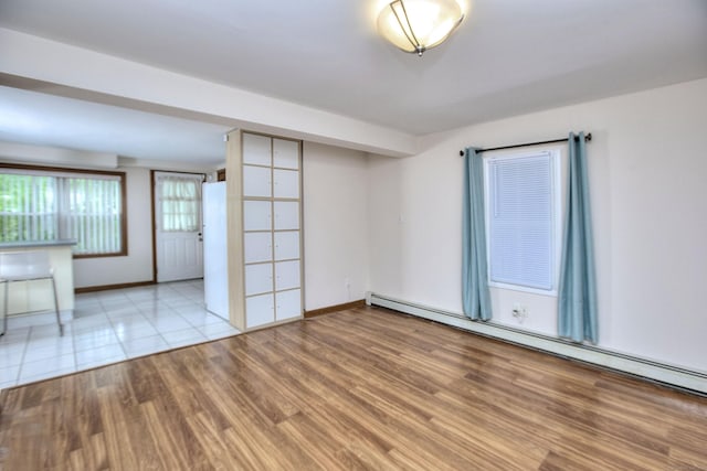 23 Davis Rd, Seymour, CT 06483 - unfurnished room with a baseboard radiator and wood finished floors