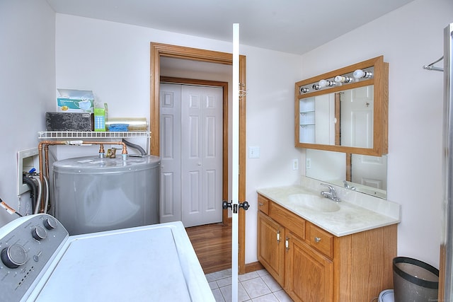 23 Davis Rd, Seymour, CT 06483 - laundry area featuring washer / clothes dryer, light tile patterned floors, and water heater