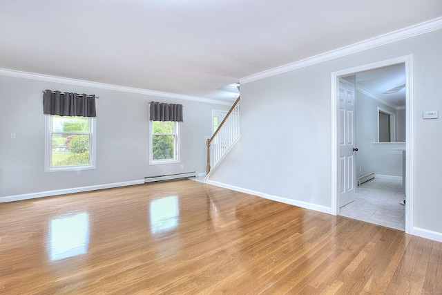 23 Davis Rd, Seymour, CT 06483 - spare room with baseboard heating, light wood-style floors, stairway, crown molding, and a baseboard heating unit