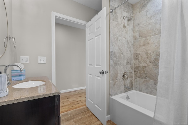 6 Bidwell Ter, Middletown, CT 06457 - bathroom with shower / tub combo with curtain, wood finished floors, vanity, and baseboards