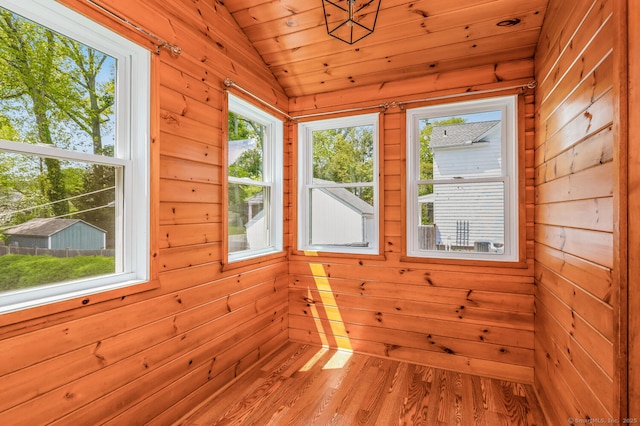 unfurnished sunroom with vaulted ceiling