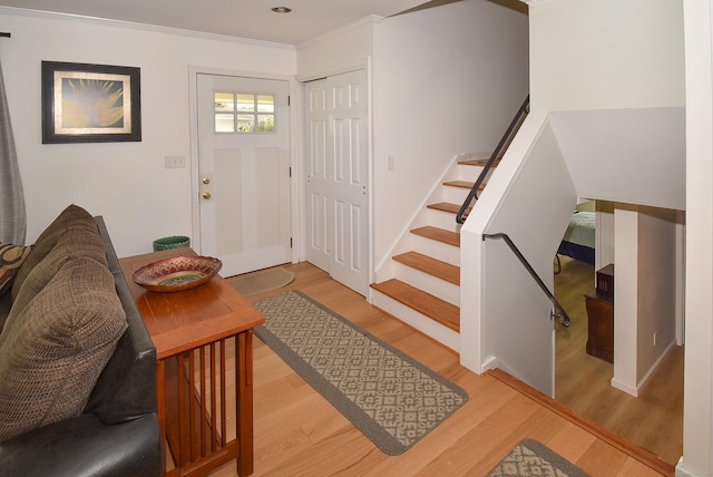 21 Craigmore Rd, Bloomfield, CT 06002 - entryway with wood finished floors, stairs, ornamental molding, and baseboards
