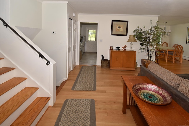 21 Craigmore Rd, Bloomfield, CT 06002 - hall with light wood-type flooring, stairs, ornamental molding, and baseboards