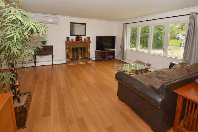 21 Craigmore Rd, Bloomfield, CT 06002 - living room with a wall unit AC, wood finished floors, a baseboard heating unit, a brick fireplace, and crown molding