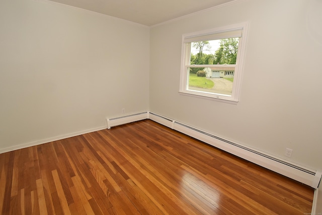 21 Craigmore Rd, Bloomfield, CT 06002 - spare room featuring a baseboard radiator, ornamental molding, wood finished floors, and a baseboard heating unit