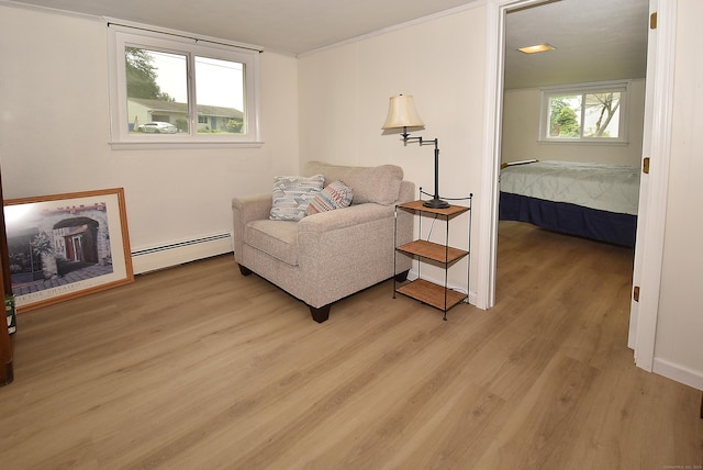 21 Craigmore Rd, Bloomfield, CT 06002 - living area featuring a baseboard heating unit and light wood finished floors