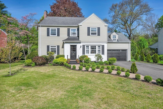 10 Meadowbrook Rd, Hamden, CT 06517 - traditional-style house with driveway, a garage, a chimney, and a front lawn