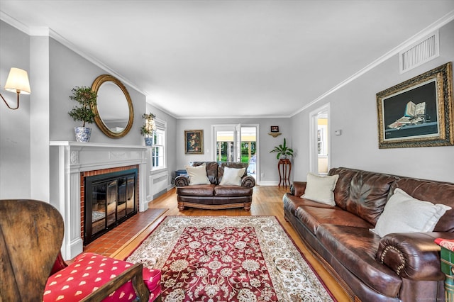 10 Meadowbrook Rd, Hamden, CT 06517 - living room featuring a fireplace, wood finished floors, ornamental molding, and baseboards