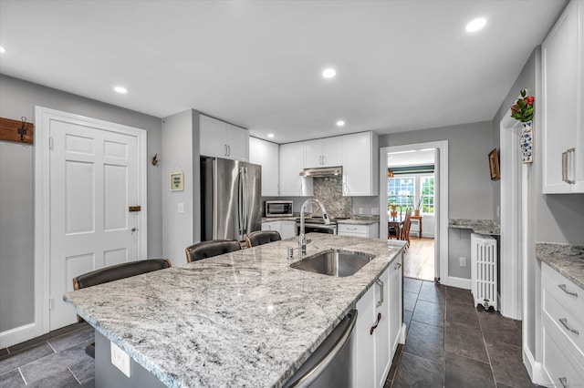 10 Meadowbrook Rd, Hamden, CT 06517 - kitchen featuring a sink, stainless steel appliances, white cabinets, recessed lighting, and a kitchen island with sink