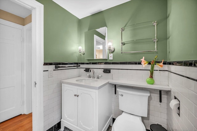 10 Meadowbrook Rd, Hamden, CT 06517 - bathroom featuring tile walls, toilet, wainscoting, and vanity