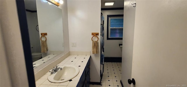 full bathroom featuring tile patterned floors, vanity, and baseboards