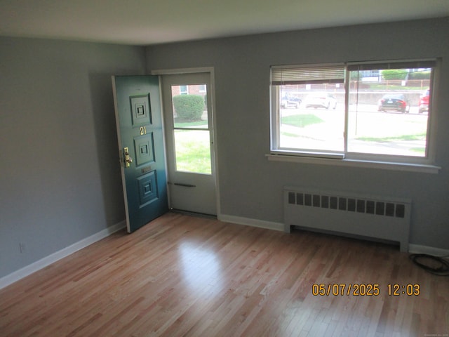 51-71 Park Ave Unit 3-21, Danbury, CT 06810 - foyer entrance featuring radiator, light wood-type flooring, and baseboards