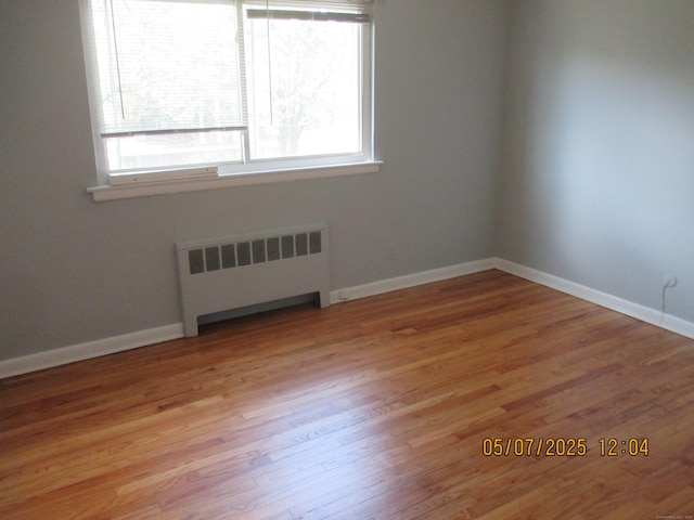 51-71 Park Ave Unit 3-21, Danbury, CT 06810 - spare room featuring radiator heating unit, light wood-type flooring, and baseboards