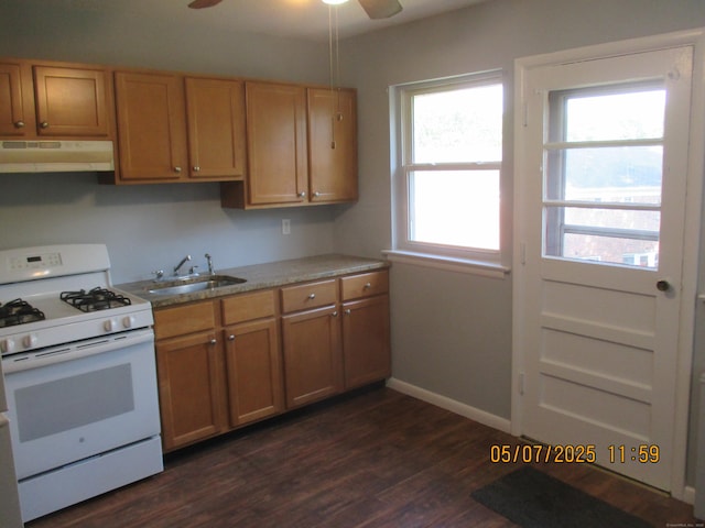 51-71 Park Ave Unit 3-21, Danbury, CT 06810 - kitchen featuring white range with gas cooktop, under cabinet range hood, a sink, ceiling fan, and dark wood finished floors
