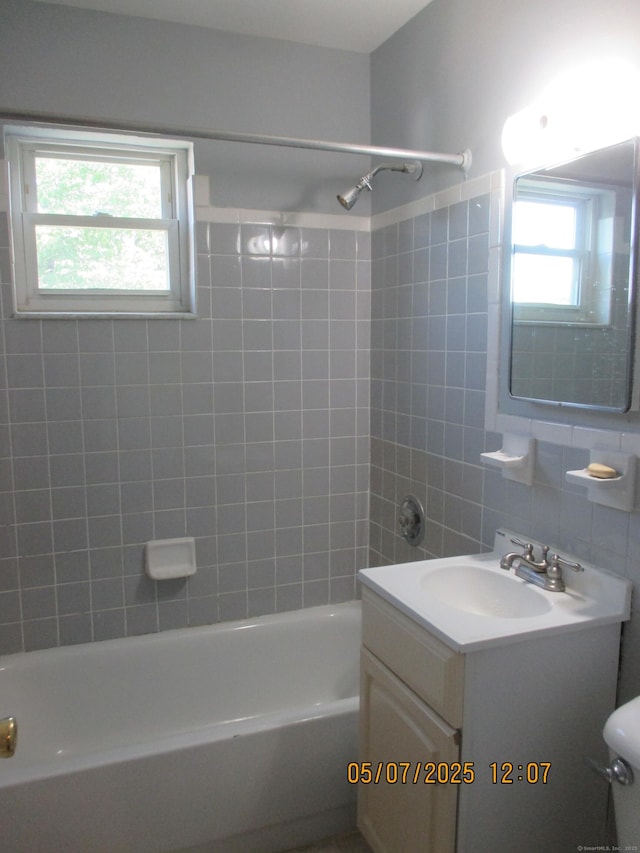 51-71 Park Ave Unit 3-21, Danbury, CT 06810 - full bathroom featuring vanity, shower / tub combination, decorative backsplash, toilet, and tile walls