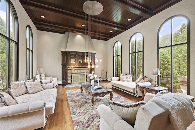 46 Mountain Farms Rd, West Hartford, CT 06117 - living room with wood ceiling with exposed beams, a textured wall, wood finished floors, and healthy amount of natural light