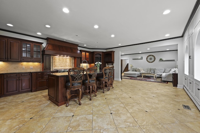 46 Mountain Farms Rd, West Hartford, CT 06117 - kitchen with crown molding, a kitchen bar, backsplash, custom range hood, and recessed lighting