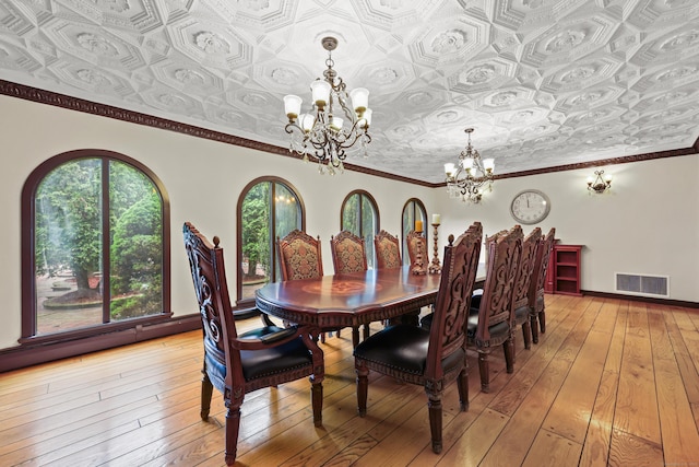 46 Mountain Farms Rd, West Hartford, CT 06117 - dining space featuring a chandelier, an ornate ceiling, and light wood-type flooring