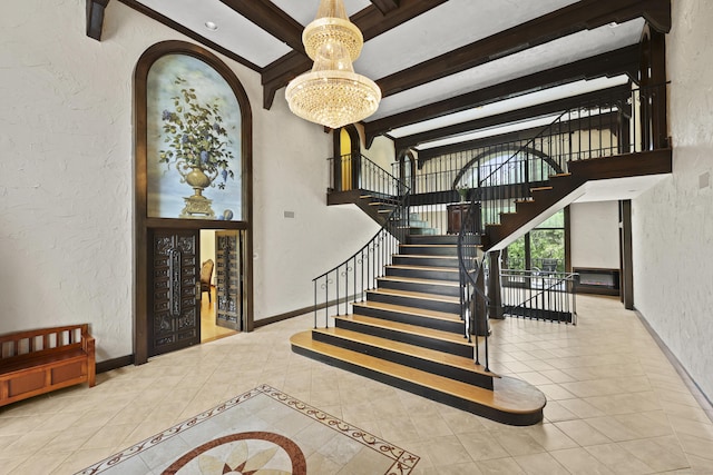 46 Mountain Farms Rd, West Hartford, CT 06117 - stairs with a textured wall, a chandelier, beam ceiling, baseboards, and arched walkways