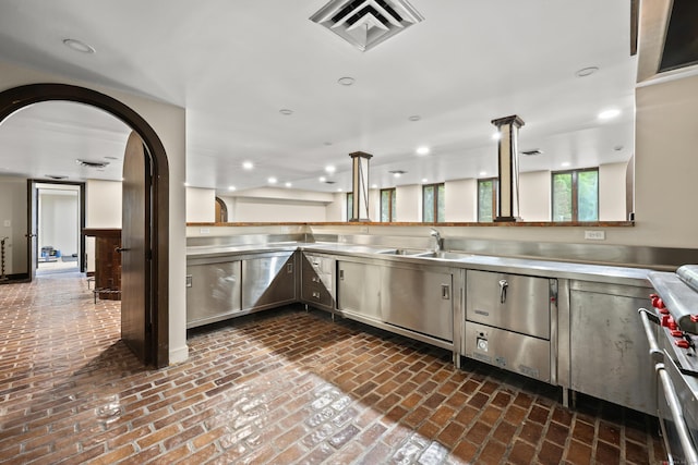 46 Mountain Farms Rd, West Hartford, CT 06117 - kitchen featuring stainless steel countertops, brick flooring, a sink, recessed lighting, and high end stainless steel range oven