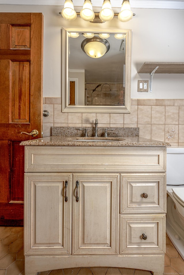 bathroom with vanity, toilet, and decorative backsplash