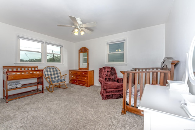 carpeted bedroom featuring ceiling fan and baseboards