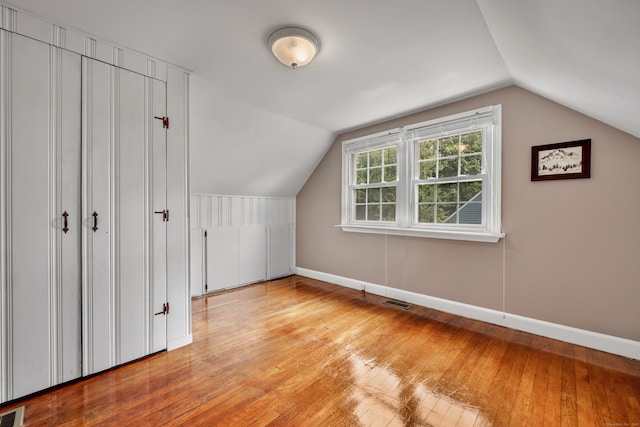 4 Hockanum Dr, East Hartford, CT 06118 - bonus room featuring hardwood / wood-style flooring and vaulted ceiling