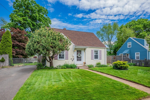 4 Hockanum Dr, East Hartford, CT 06118 - view of front of property with asphalt driveway and a shingled roof