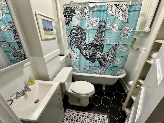 bathroom featuring tile patterned floors, toilet, and vanity