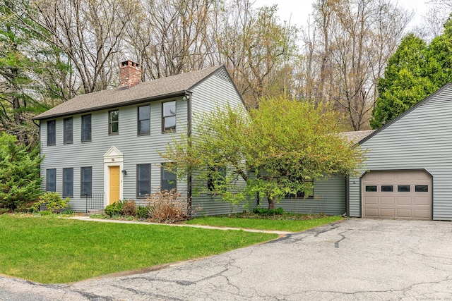 433 Kent Cornwall Rd Unit 14, Kent, CT 06757 - colonial inspired home with a chimney, driveway, a garage, roof with shingles, and a front yard
