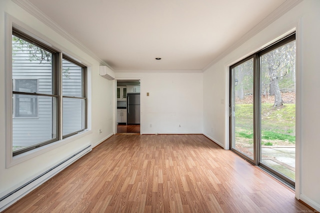 433 Kent Cornwall Rd Unit 14, Kent, CT 06757 - unfurnished room with a baseboard heating unit, light wood finished floors, plenty of natural light, baseboards, and crown molding