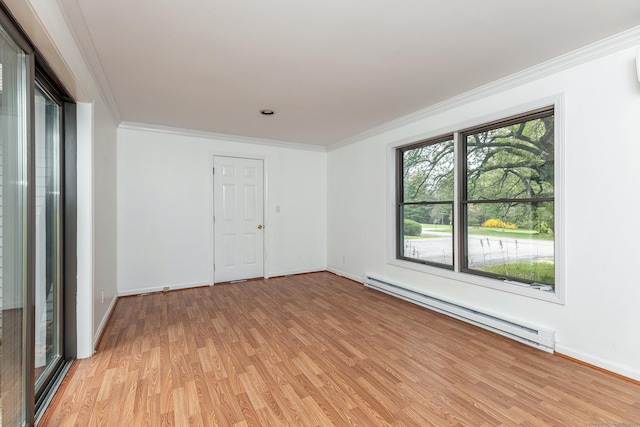 433 Kent Cornwall Rd Unit 14, Kent, CT 06757 - spare room with baseboard heating, light wood-style flooring, baseboards, and ornamental molding