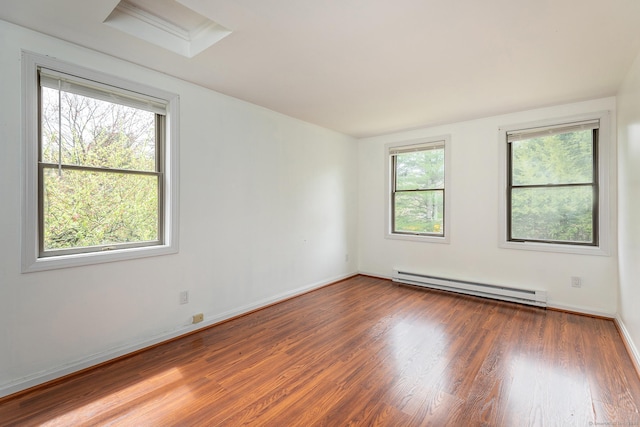 433 Kent Cornwall Rd Unit 14, Kent, CT 06757 - unfurnished room with a baseboard heating unit, wood finished floors, and baseboards