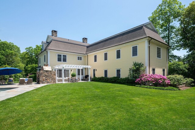 37 Lantern Hill Rd, Madison, CT 06443 - rear view of property featuring a pergola, a patio, a yard, and a chimney