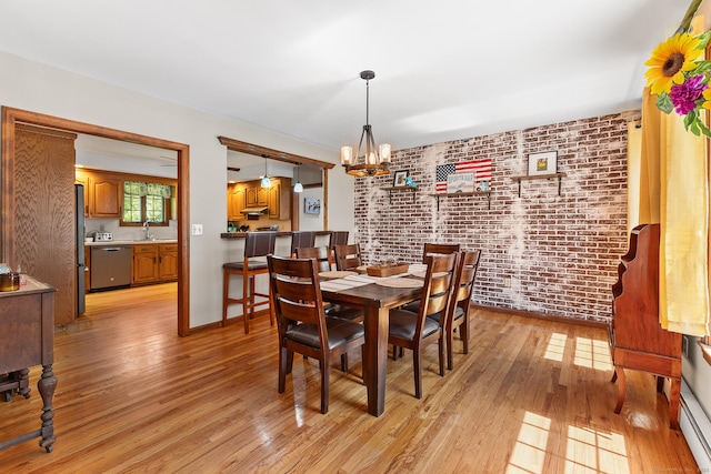 241 New London Rd, Colchester, CT 06415 - dining area with a chandelier, brick wall, light wood-type flooring, and baseboards