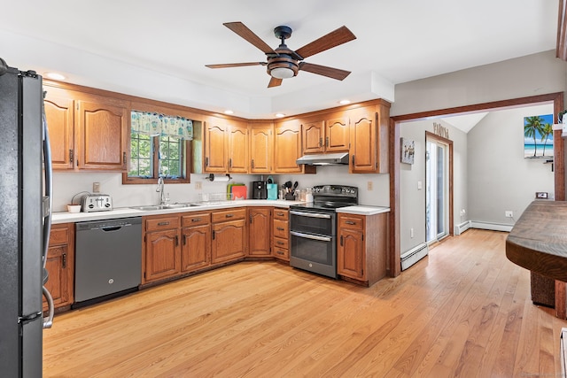 241 New London Rd, Colchester, CT 06415 - kitchen with appliances with stainless steel finishes, a sink, under cabinet range hood, a baseboard heating unit, and baseboard heating