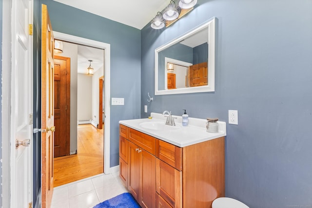 241 New London Rd, Colchester, CT 06415 - bathroom featuring baseboard heating, tile patterned flooring, vanity, and baseboards